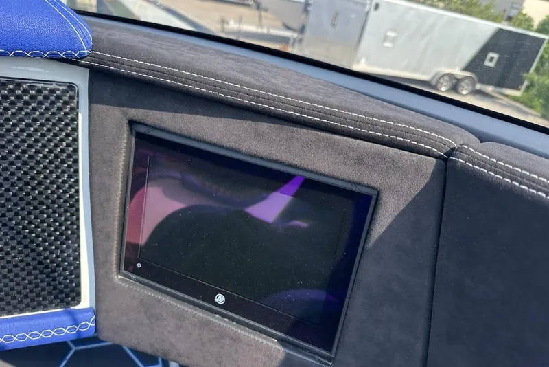 Slide: The Image of Dashboard of a 2018 Wright Performance 420 boat with carbon fiber and blue accents. - 38