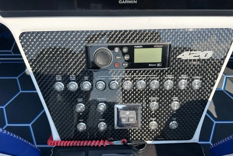 Slide: The Image of Control panel of a 2018 Wright Performance 420 boat with carbon fiber finish. - 40