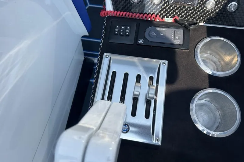 Slide: The Image of Control panel of 2018 Wright Performance 420 boat with throttle levers and cup holders. - 41