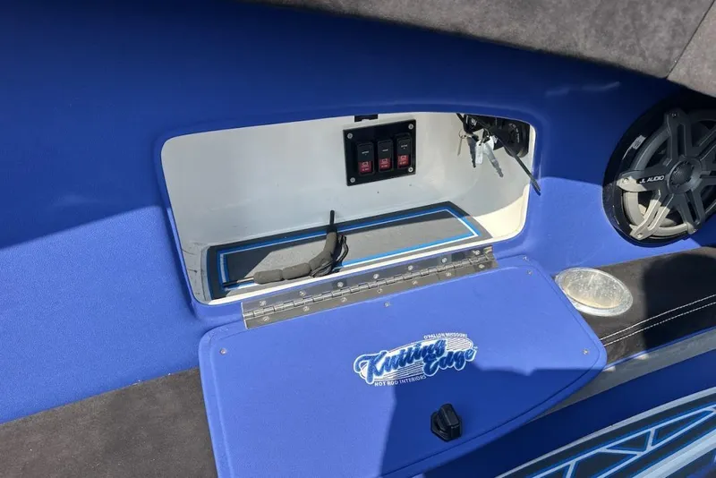 Slide: The Image of Interior of a 2018 Wright Performance 420 boat with blue accents and audio system. - 44