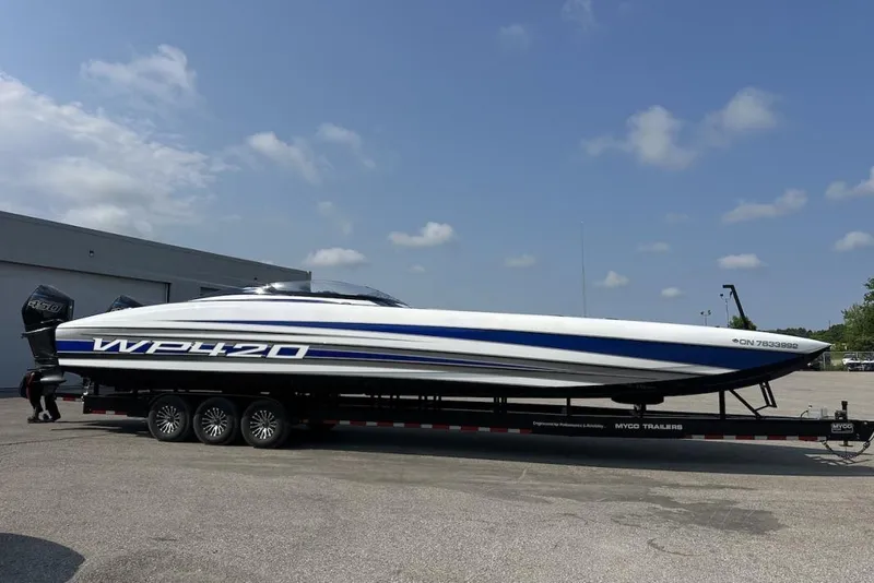 Slide: The Image of 2018 Wright Performance 420 boat on trailer, parked outdoors under a clear sky. - 5