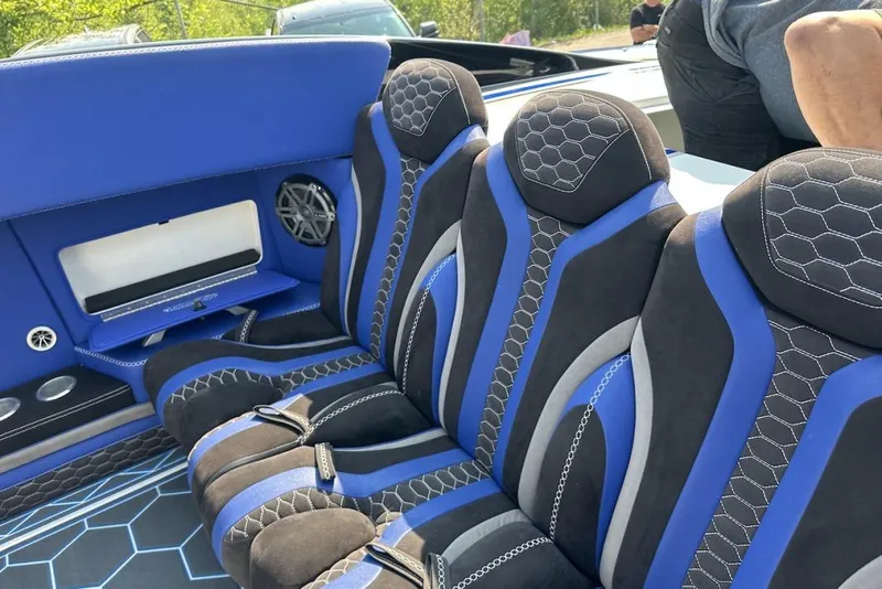 Slide: The Image of Luxurious blue and black interior of 2018 Wright Performance 420 boat with hexagonal patterns. - 50