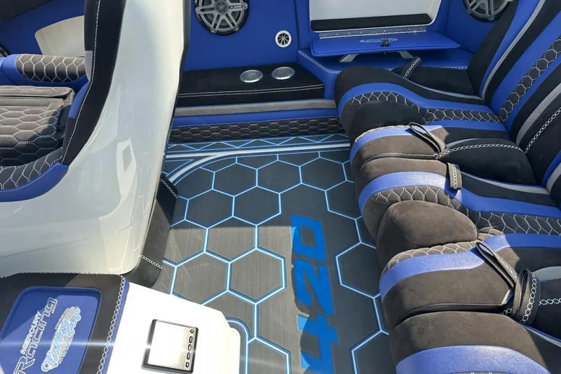 Slide: The Image of Luxurious interior of a 2018 Wright Performance 420 boat with blue and black seating. - 51