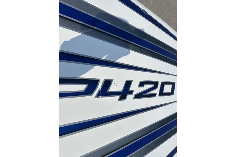 Slide: The Image of Close-up of Wright Performance 420 boat model, featuring sleek blue and white design. - 55