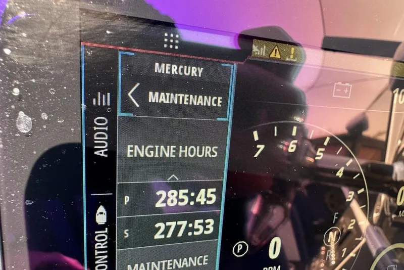 Slide: The Image of Close-up of a 2018 Wright Performance 420 dashboard displaying engine hours and maintenance alerts. - 59