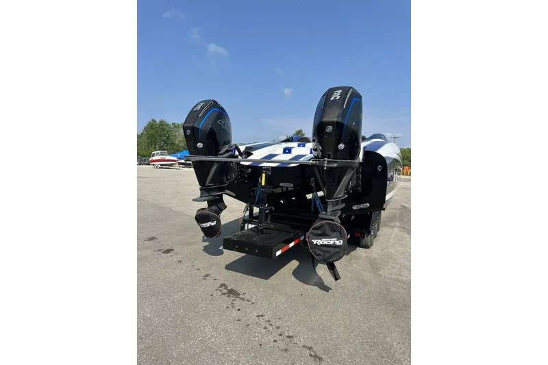 Slide: The Image of 2018 Wright Performance 420 boat with dual outboard motors on a trailer. - 6