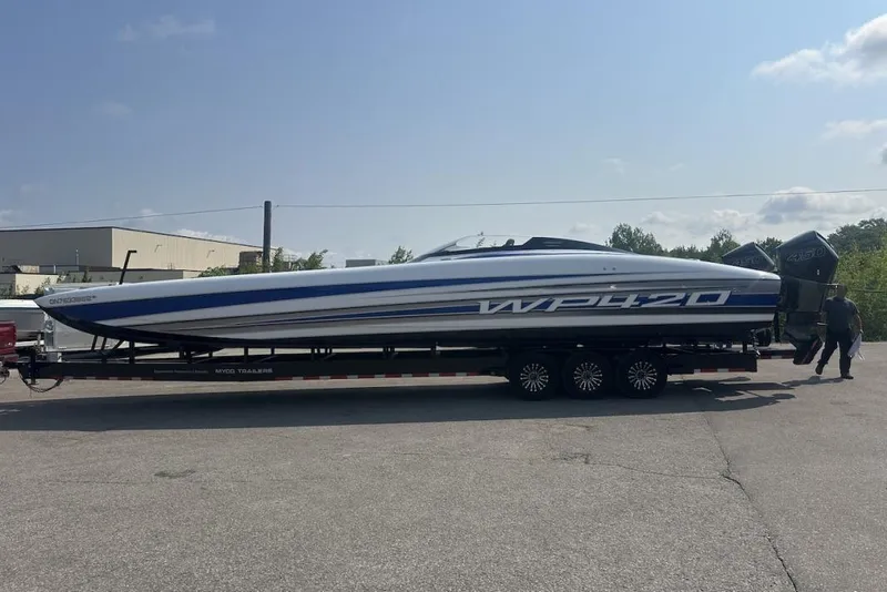 Slide: The Image of 2018 Wright Performance 420 speedboat on trailer, parked outdoors under clear sky. - 68