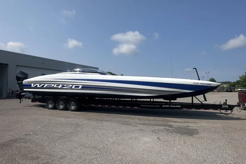 Slide: The Image of 2018 Wright Performance 420 boat on trailer, parked outdoors under clear sky. - 69