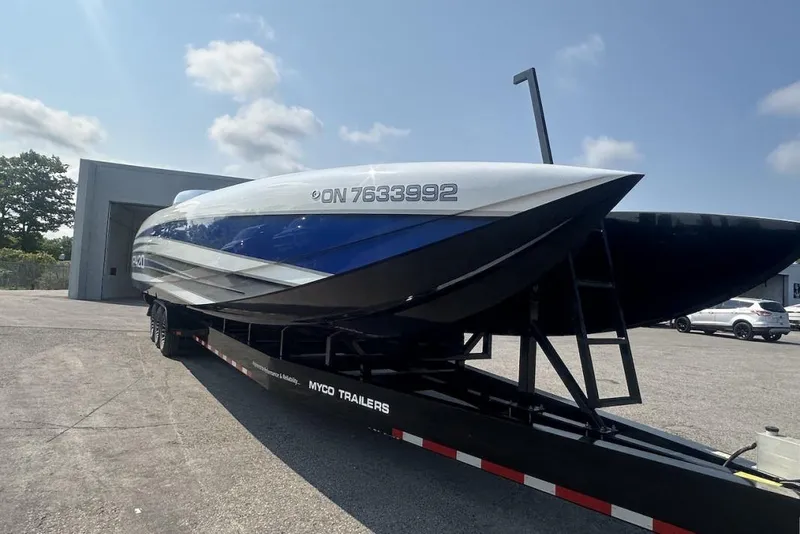 Slide: The Image of 2018 Wright Performance 420 boat on trailer, parked outdoors under a clear sky. - 72