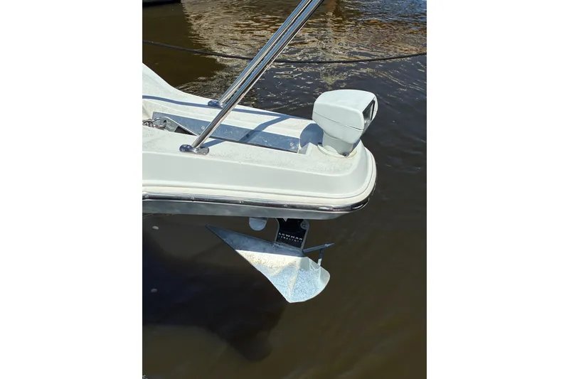 Slide: The Image of Bow of a 1999 Trojan 360 Express boat with anchor and railing. - 2