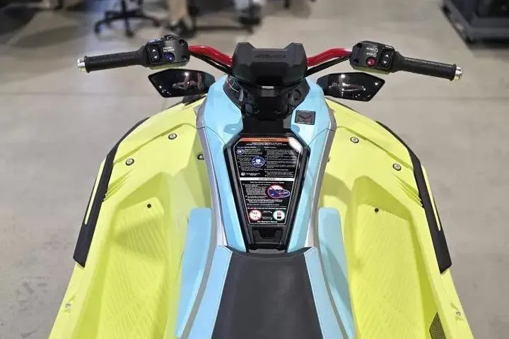 Slide: The Image of 2026 Yamaha WaveRunner JetBlaster PRO 3-Up, vibrant yellow and blue design, handlebars view. - 16
