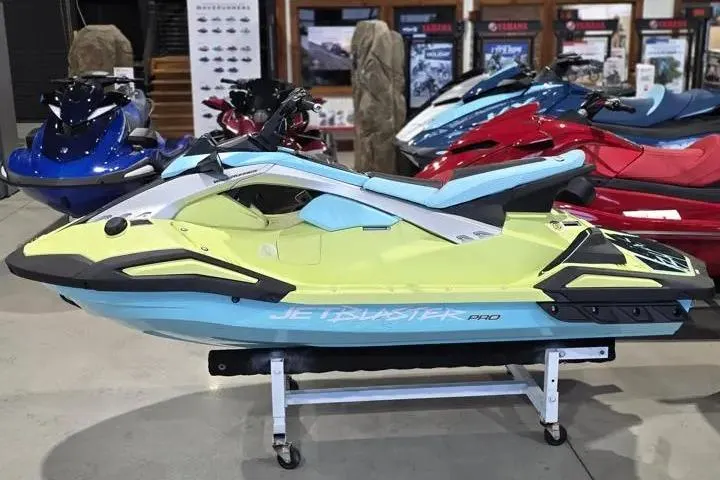 Slide: The Image of 2026 Yamaha WaveRunner JetBlaster PRO 3-Up in showroom, vibrant colors, side view. - 4