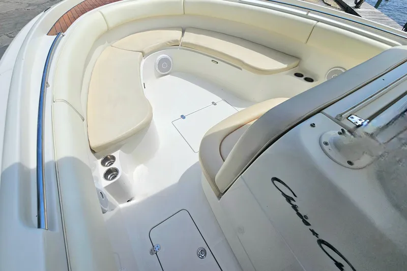 Slide: The Image of 2008 Chris-Craft Catalina 29 boat interior with cushioned seating and sleek design. - 10
