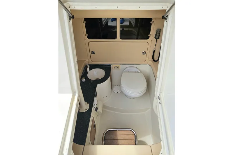 Slide: The Image of 2008 Chris-Craft Catalina 29 boat bathroom with sink and toilet. - 13