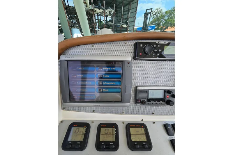 Slide: The Image of Dashboard of a 2008 Chris-Craft Catalina 29 with navigation and control systems. - 17