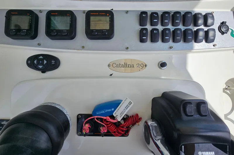 Slide: The Image of Dashboard of a 2008 Chris-Craft Catalina 29 boat with controls and gauges. - 18