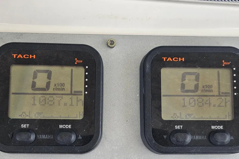 Slide: The Image of Digital tachometers on a 2008 Chris-Craft Catalina 29 boat dashboard. - 19
