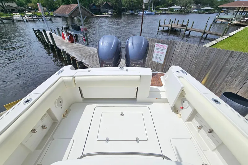 Slide: The Image of 2008 Chris-Craft Catalina 29 boat with dual engines docked at a marina. - 20