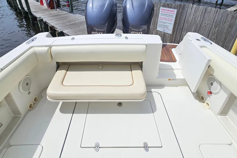 Slide: The Image of 2008 Chris-Craft Catalina 29 boat interior with seating and twin outboard engines. - 22