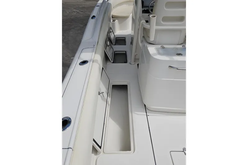 Slide: The Image of 2008 Chris-Craft Catalina 29 boat interior with open storage compartments. - 23