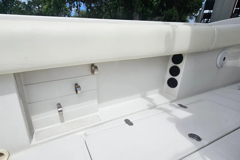 Slide: The Image of 2008 Chris-Craft Catalina 29 boat interior detail with storage compartments and seating. - 27