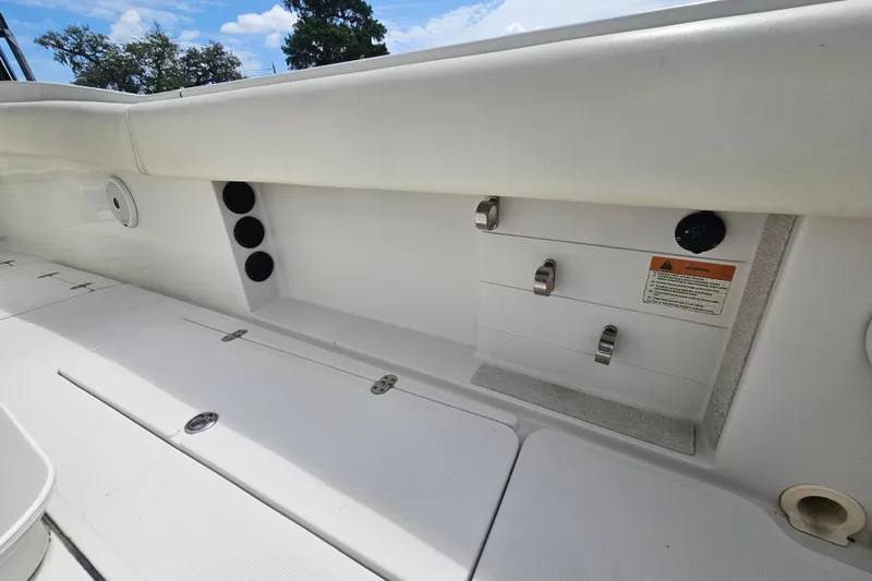 Slide: The Image of 2008 Chris-Craft Catalina 29 boat interior with storage compartments and seating. - 28