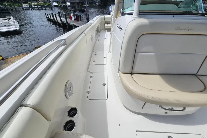 Slide: The Image of 2008 Chris-Craft Catalina 29 boat interior with beige seating and sleek design. - 30
