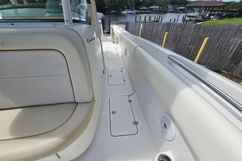 Slide: The Image of 2008 Chris-Craft Catalina 29 boat interior with beige seating and sleek design. - 31