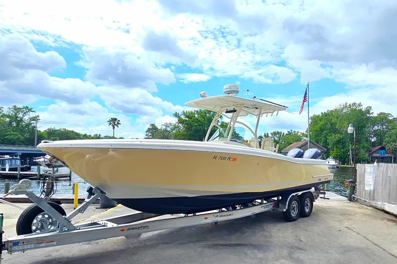 Slide: The Image of 2008 Chris-Craft Catalina 29 boat on trailer, dockside with scenic background. - 6