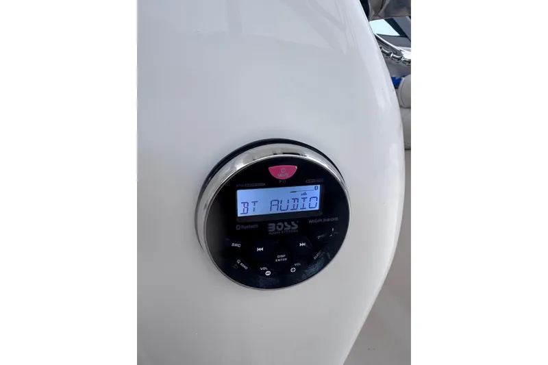 Slide: The Image of Bluetooth audio system on 2003 Robalo R265 Walkaround boat dashboard. - 10