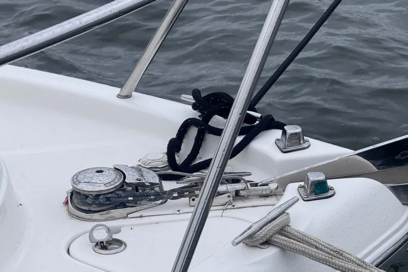 Slide: The Image of 2003 Robalo R265 Walkaround boat deck with anchor and ropes. - 9