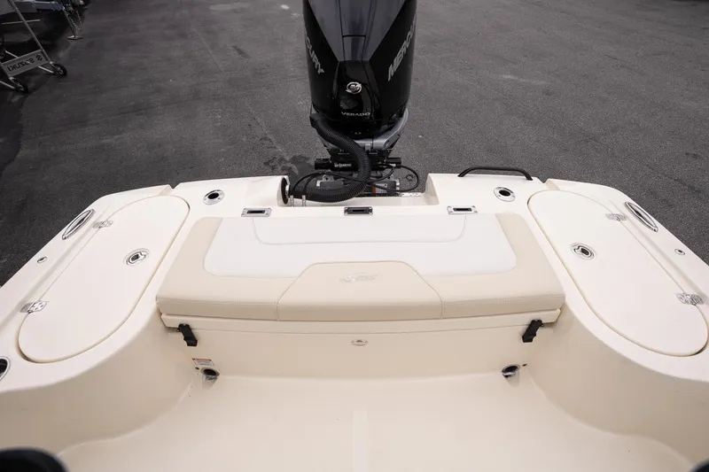 Slide: The Image of 2026 Scout 231 XSB boat stern with Mercury outboard motor and seating area. - 12