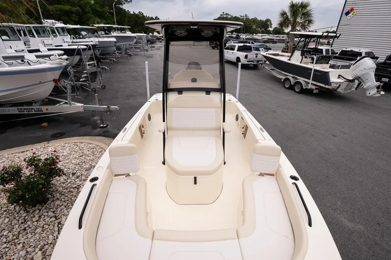 Slide: The Image of 2026 Scout 231 XSB boat displayed in a marina with other vessels. - 17