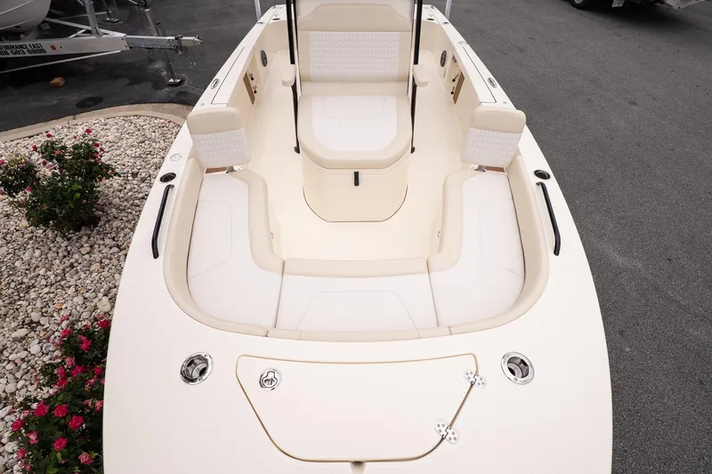 Slide: The Image of 2026 Scout 231 XSB boat interior with cushioned seating and sleek design. - 18