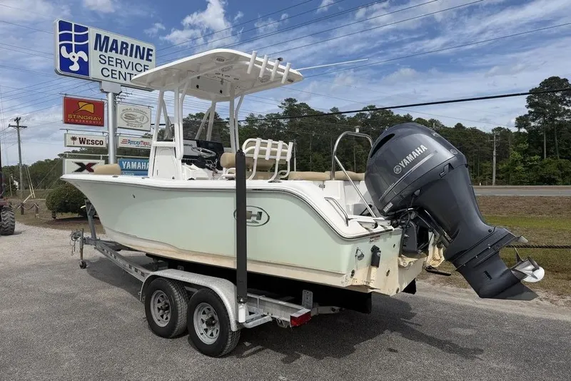 Slide: The Image of 2018 Sea Hunt Ultra 225 boat on trailer at marine service center. - 3