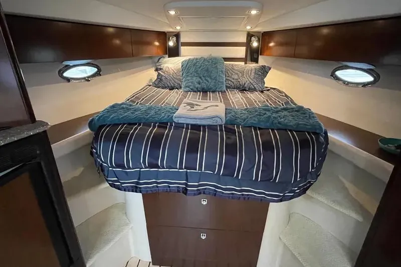 Slide: The Image of Luxurious cabin interior of 2012 Cruisers Yachts 380 Express with cozy bedding. - 10