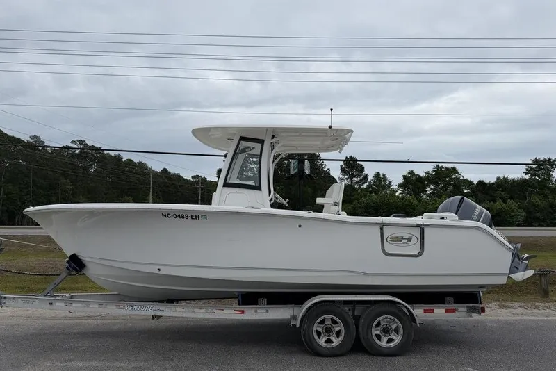 The Image of 2018 Sea Hunt Ultra 255 SE boat on trailer, side view. - 1