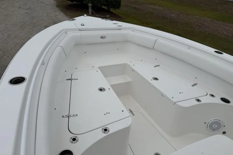 Slide: The Image of 2018 Sea Hunt Ultra 255 SE boat interior with spacious seating and storage compartments. - 10