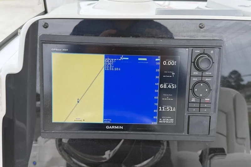 Slide: The Image of Garmin GPS display on 2018 Sea Hunt Ultra 255 SE boat, showing navigation and water temperature. - 11