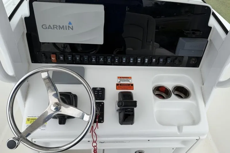 Slide: The Image of Steering console of 2018 Sea Hunt Ultra 255 SE with Garmin navigation system. - 12