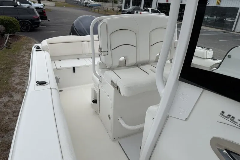 Slide: The Image of 2018 Sea Hunt Ultra 255 SE boat interior with seating and storage compartments. - 14