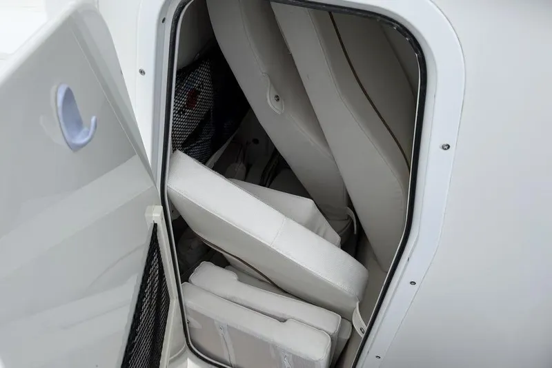 Slide: The Image of Storage compartment with cushions in a 2018 Sea Hunt Ultra 255 SE boat. - 16
