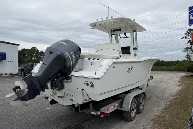 Slide: The Image of 2018 Sea Hunt Ultra 255 SE boat on trailer with Yamaha outboard motor. - 7