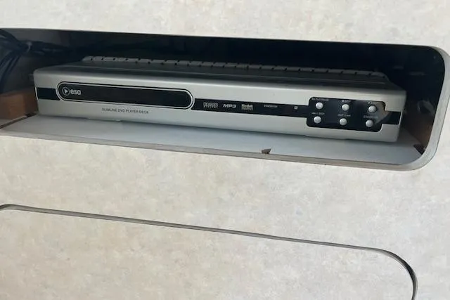 Slide: The Image of DVD player in a shelf, Regal Commodore 322, 1997 model. - 17