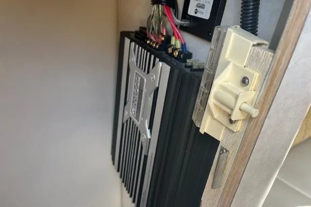 Slide: The Image of Amplifier installation in a 1997 Regal Commodore 322 boat interior. - 23
