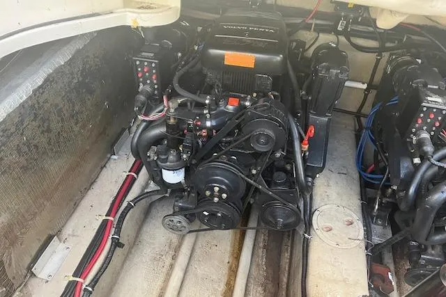 Slide: The Image of Engine compartment of a 1997 Regal Commodore 322 boat, showcasing mechanical components. - 25