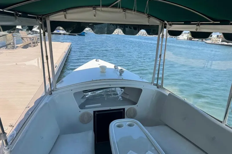 Slide: The Image of Interior view of a 2001 Duffy Classic 21 boat docked by the water. - 3