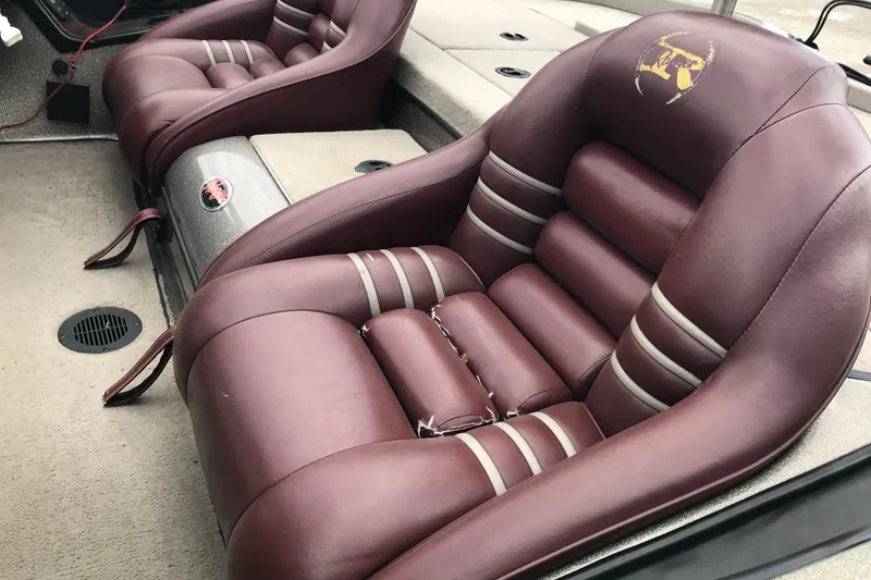 Slide: The Image of Maroon leather seats in a 2001 Ranger 518DVX Comanche boat interior. - 19