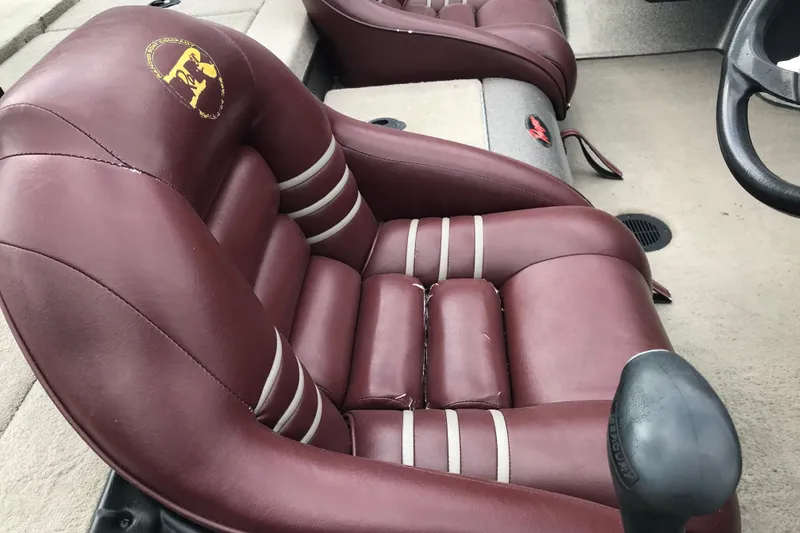Slide: The Image of Maroon leather seat in 2001 Ranger 518DVX Comanche boat interior. - 22