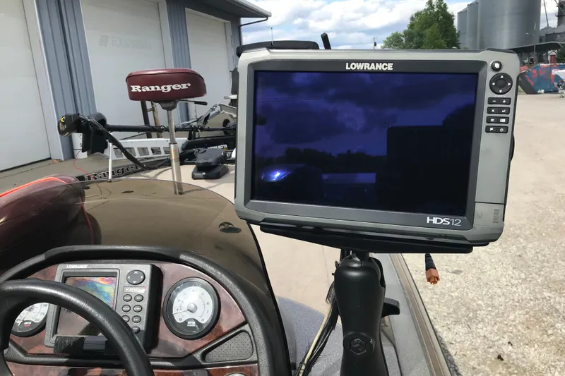 Slide: The Image of 2001 Ranger 518DVX Comanche boat dashboard with Lowrance HDS12 fishfinder display. - 23